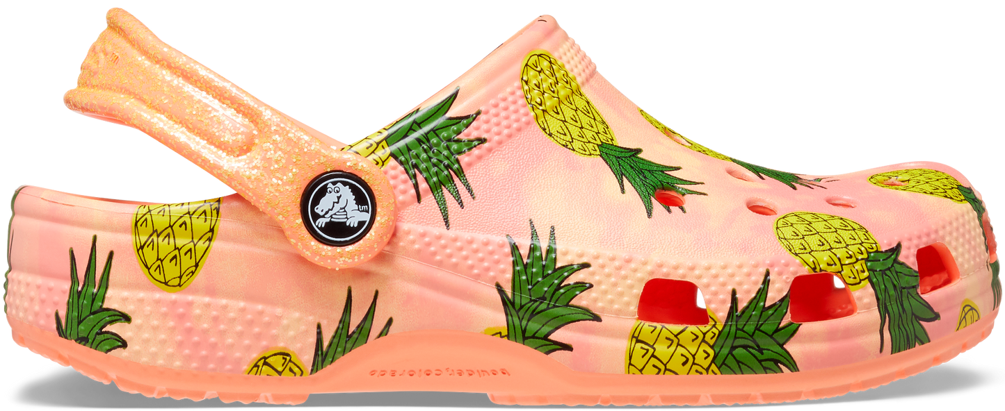 A vibrant papaya-colored CROCS CLASSIC POOL PARTY CLOG 207826-83E featuring ananas design