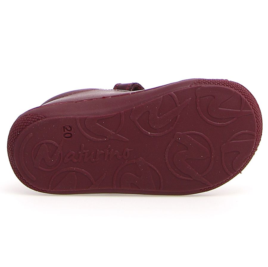 Child's feet wearing NATURINO Halbschuh COCOON - magnolia - magnolia shoes, demonstrating their perfect fit and comfort for active kids