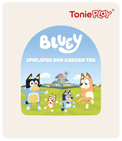 Vorderansicht: Bluey Lesespiel-3er-Set mit blauem Bogen, spielende Hunde vor Wiese; ToniePlay-Logo.