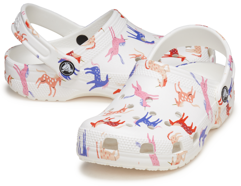 A pair of CROCS TODDLER CLASSIC CHARACTER PRINT CLOG 209697-9CD featuring a colorful unicorn design on a white background