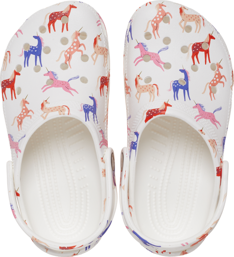 A colorful pair of CROCS TODDLER CLASSIC CHARACTER PRINT CLOG 209697-9CD featuring a whimsical unicorn design