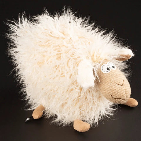 Seitenansicht eines Sigikid BEASTS Wish Moppel Stofftier, weißes Flauschfell, beigefarbenes Gesicht.