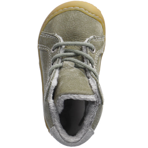 Young girl happily wearing RICOSTA Knöchelschuh GEORGIE eukalyptus hellgrau shoe while playing outside