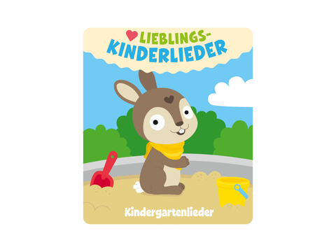 Vorderansicht: Tonies-Figur eines braunen Hasen mit gelbem Schal im Sandkasten, rote Schaufel, gelber Eimer.