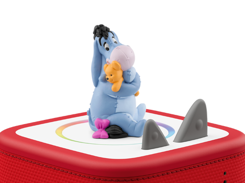 Tonies Figur Disney Winnie Puuh I-Aah auf roter Tonie-Box; blaue Eeyore-Figur hält Pooh.