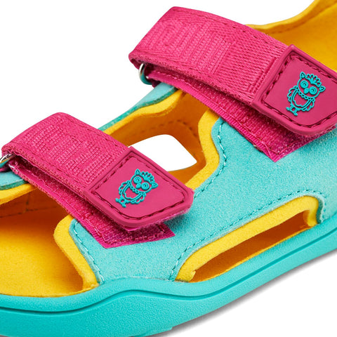 Vibrant turquoise and pink vegan airy owl sandal with playful design