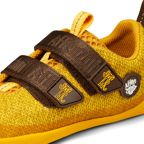 Yellow and brown AFFENZAHN Barfuß Halbschuh KNIT HAPPY TIGER, a playful and comfortable knit shoe for kids