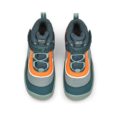 Nahaufnahme der Sohle des veganen AFFENZAHN TEX Knöchelschuhs in petrol und orange, zeigt das Profil