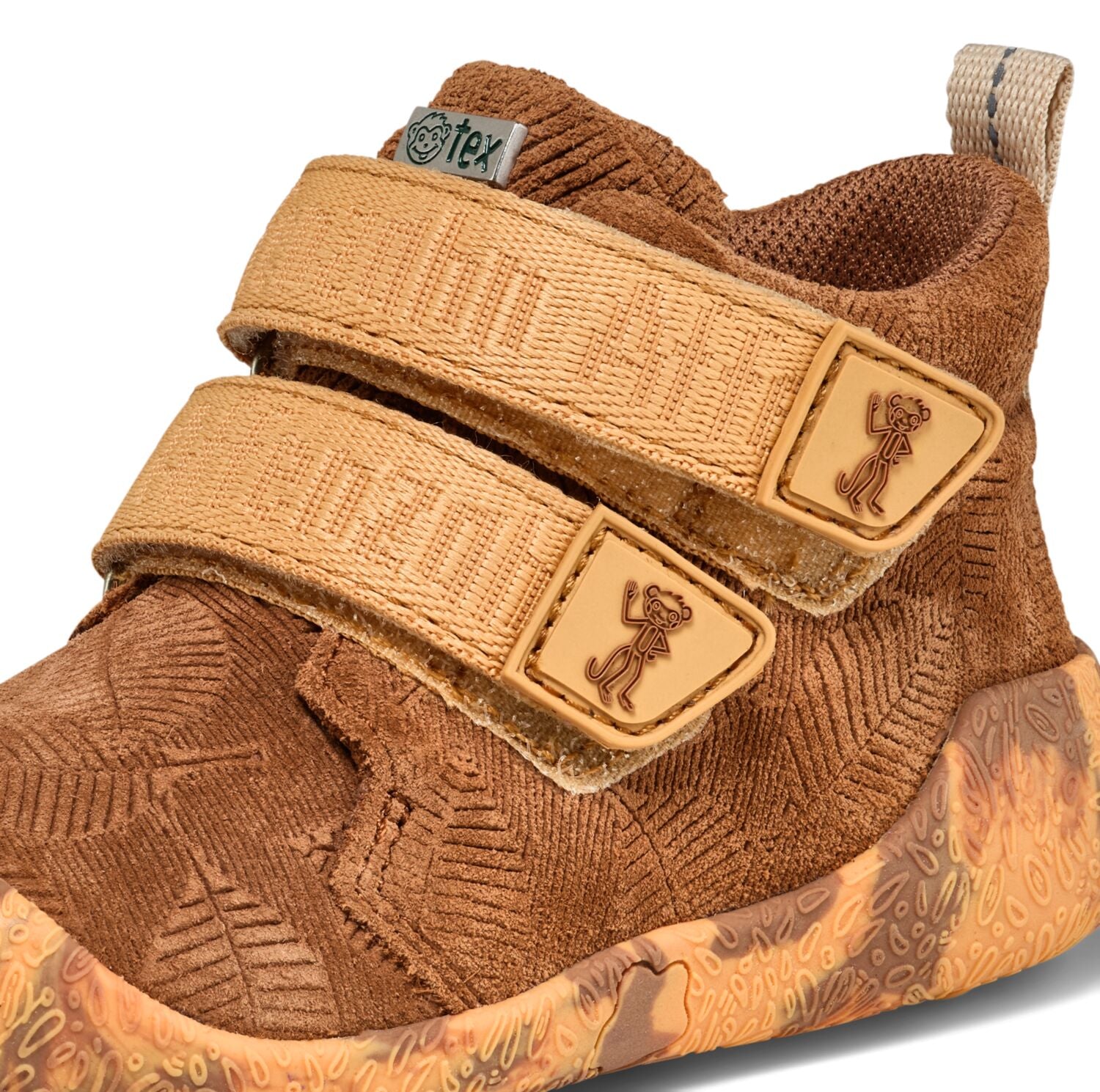 Blick auf die strapazierfähige Ledersohle des braunen AFFENZAHN TEX Knöchelschuhs mit Talky Affe Dekor