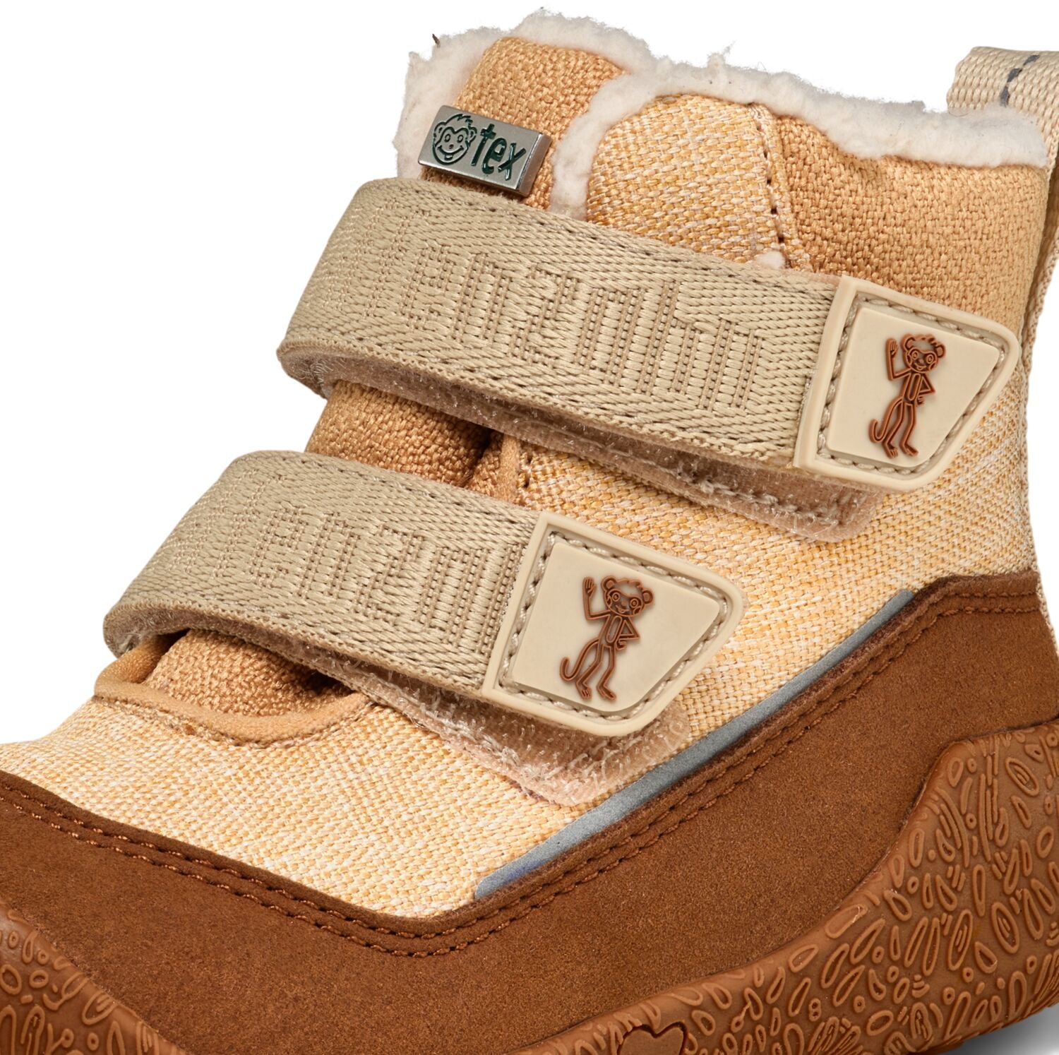 Stylischer SNUGGY AFFE vegane Stiefel in warmen Braun- und Beigetönen, ideal für kalte Jahreszeiten