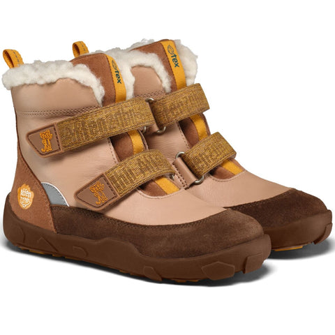 Seitenansicht der AFFENZAHN TEX Stiefel Leder WINTY PONY in Braun-Beige mit Fellrand und Klettverschlüssen.