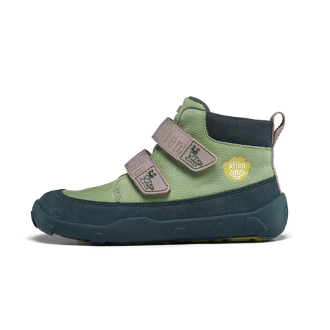 Seitenansicht des AFFENZAHN Sneaker Knöchelschuh, Leder, mint/grün, Klettverschlüsse, gelbes Logo.