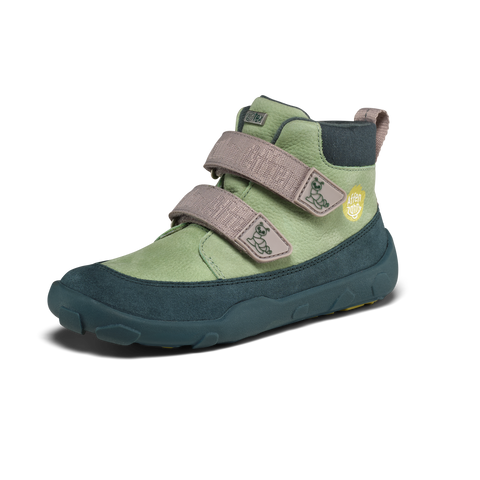 Seitenansicht des AFFENZAHN TEX Knöchelschuh, mintgrün mit dunkelblauer Sohle, zwei Klettverschlüsse, Logo-Patch.