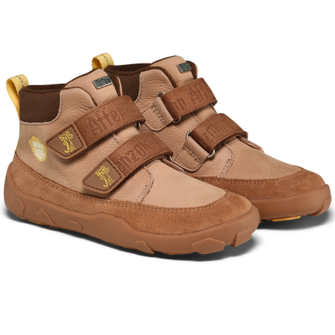 Seitenansicht: AFFENZAHN Sneaker Knöchelschuh in Braun-Beige Leder mit zwei Klettverschlüssen und gelben Zuglaschen.