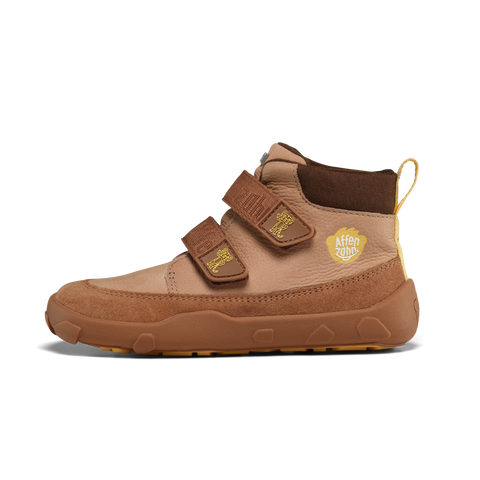 Schuhe AFFENZAHN Tex Knöchelschuh aus braunem Leder, Klettverschluss, gelbes Logo an der Seite.