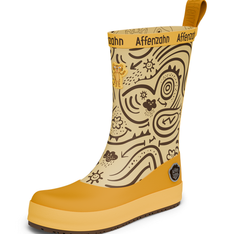 Vorderansicht des AFFENZAHN Gummistiefels Modell TIGER, gelb-braun mit grafischem Muster, gelber Sohle und Logo-Patch.