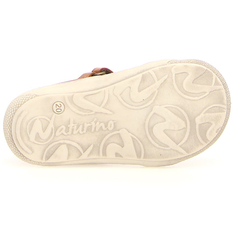 Young girl walking in NATURINO HALBSANDALE LANGEN - COGNAC sandals with adjustable ankle strap