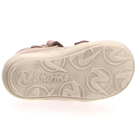 Young girl wearing NATURINO Halbsandale PUFFY - taupe, enjoying comfort and style on a summer day