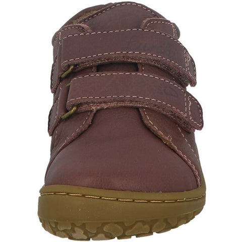 Young girl wearing LURCHI Barfuß Halbschuh NORIKO - aubergine shoe while playing outdoors