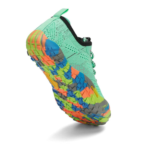 Seitenansicht des SAGUARO Barfußschuh KID SMART in Mint/Multi; mintgrünes Obermaterial, bunte grob profilierte Sohle.