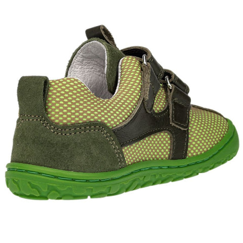 Child wearing the LURCHI Barfuß Halbschuh NEVIO 50001-26 while playing in the park