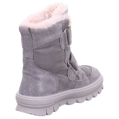 Pair of Superfit Flavia 218-250 boots being worn by a person walking on a trail