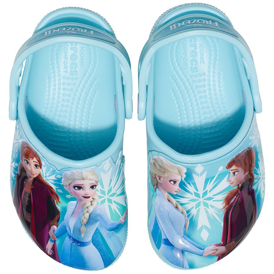 A pair of eisblau colored CROCS DISNEY FROZEN CLOG 206804-4O9 shoes featuring characters from the movie Frozen