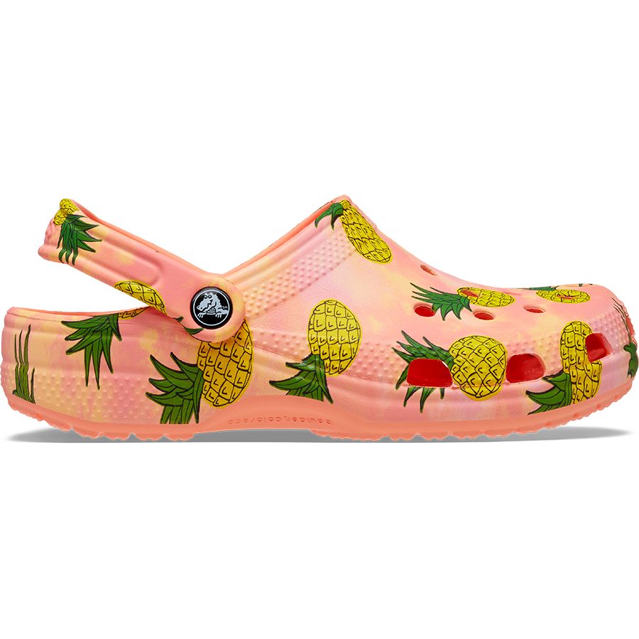 Close-up image of CROCS CLASSIC RETRO RESORT CLOG 207849-83F in papaya color with Ananas pattern, a comfortable and stylish footwear option for leisure and casual wear