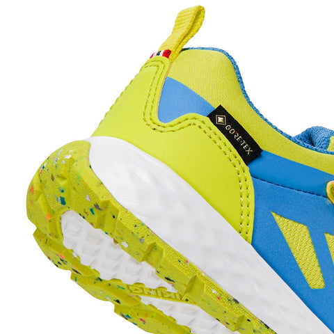 A close-up image of the VIKING GORE-TEX Halbschuh VEME GTX in lime and blue color, showcasing its durable waterproof construction