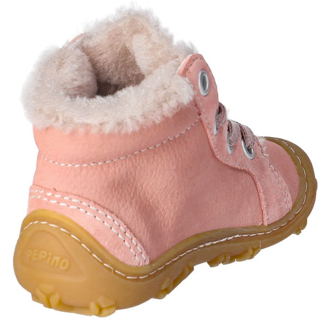 Young girl wearing RICOSTA Knöchelschuh ELIA - altrosa ankle boot while playing outside