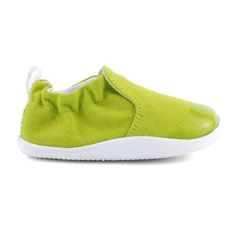 Close-up of lime green BOBUX PreWalker XP SCAMP 501704 baby shoes on white background