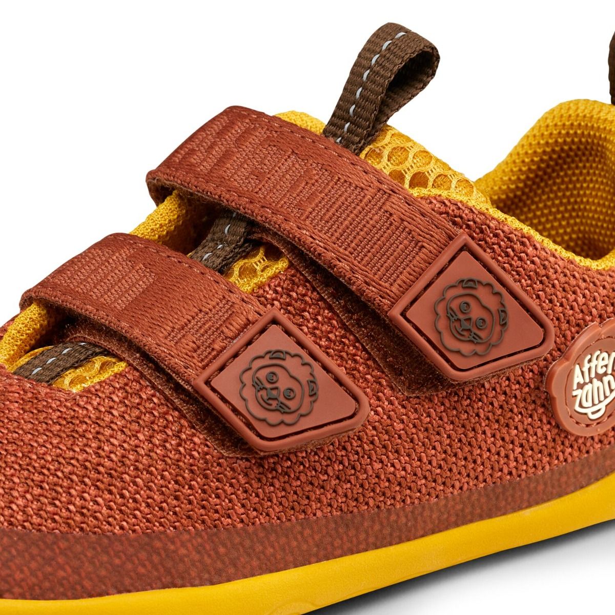 Red-brown and yellow AFFENZAHN Barfuß Halbschuh KNIT HAPPY LÖWE shoe with lion design